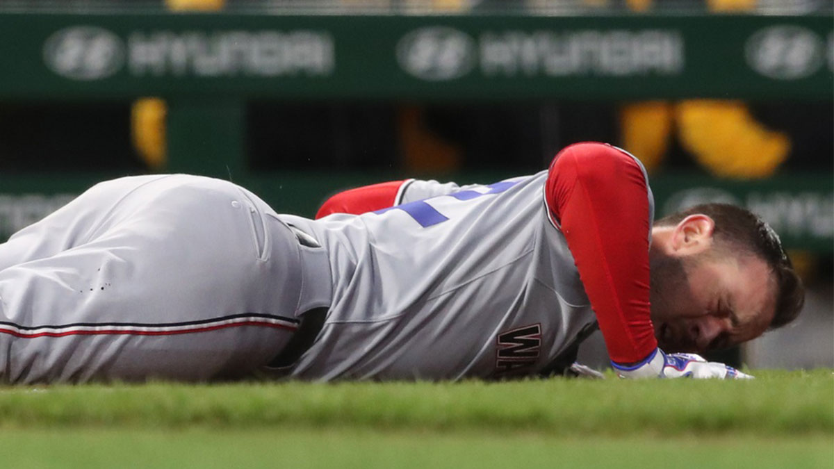 Washington Nationals third baseman Paul DeJong (14) reacts after being hit in the face by a Pittsburgh Pirates pitch during the sixth inning at PNC Park.
