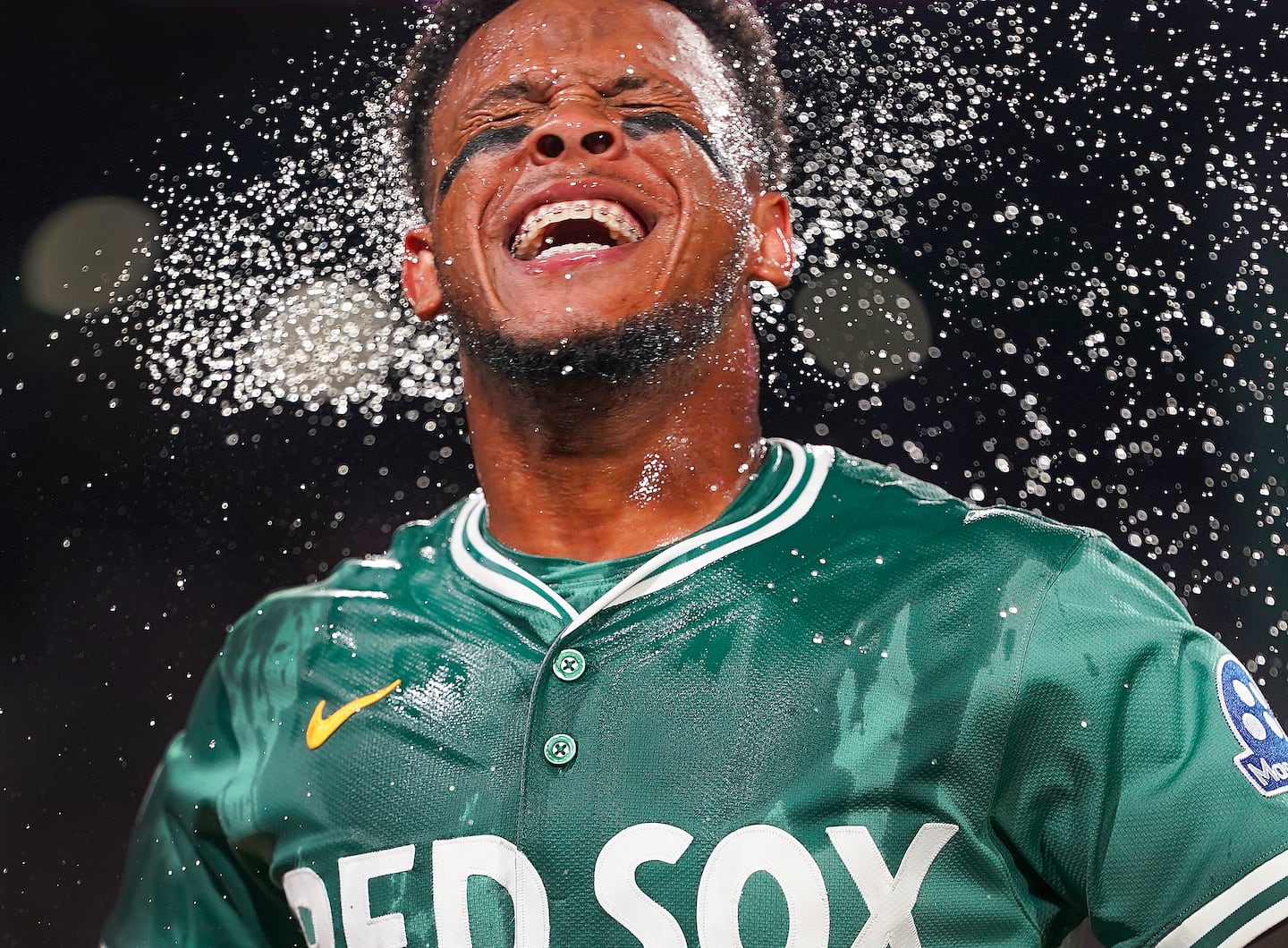 Boston Red Sox center fielder Ceddanne Rafaela reacted to his ice bucket shower after hitting a two-run, walk-off home run against the Tampa Bay Rays on July 11 at Fenway Park in Boston.