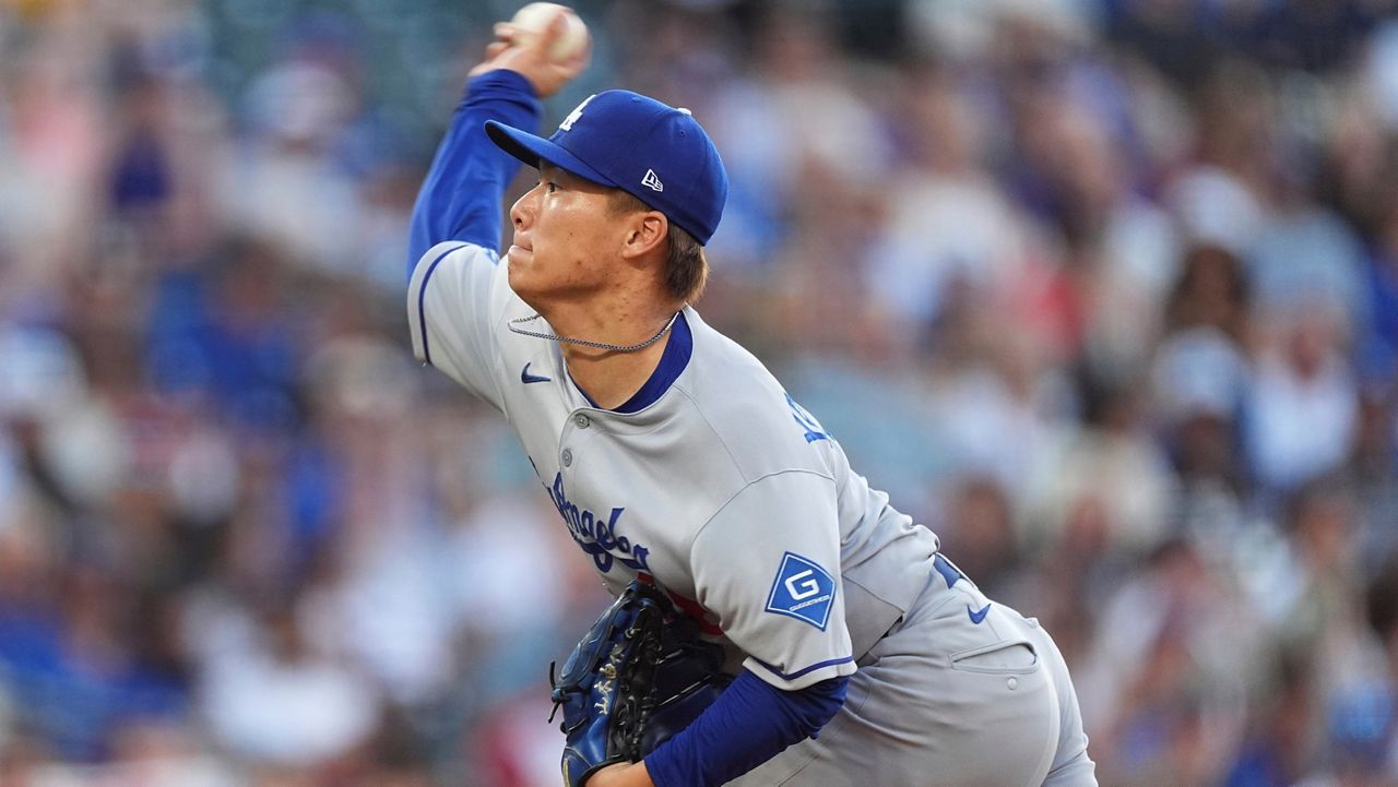 Los Angeles Dodgers starting pitcher Yoshinobu Yamamoto works against the Colorado Rockies in the first inning of a baseball game, Monday, Aug. 18, 2025, in Denver. (AP Photo/David Zalubowski)