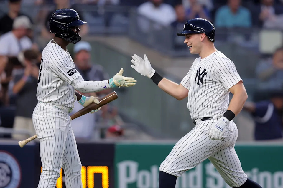 Aug 11, 2025; Bronx, New York, USA; New York Yankees catcher Ben Rice (22) celebrates his solo home run against the Minnesota Twins with second baseman Jazz Chisholm Jr. (13) during the third inning at Yankee Stadium. Mandatory Credit: Brad Penner-Imagn Images