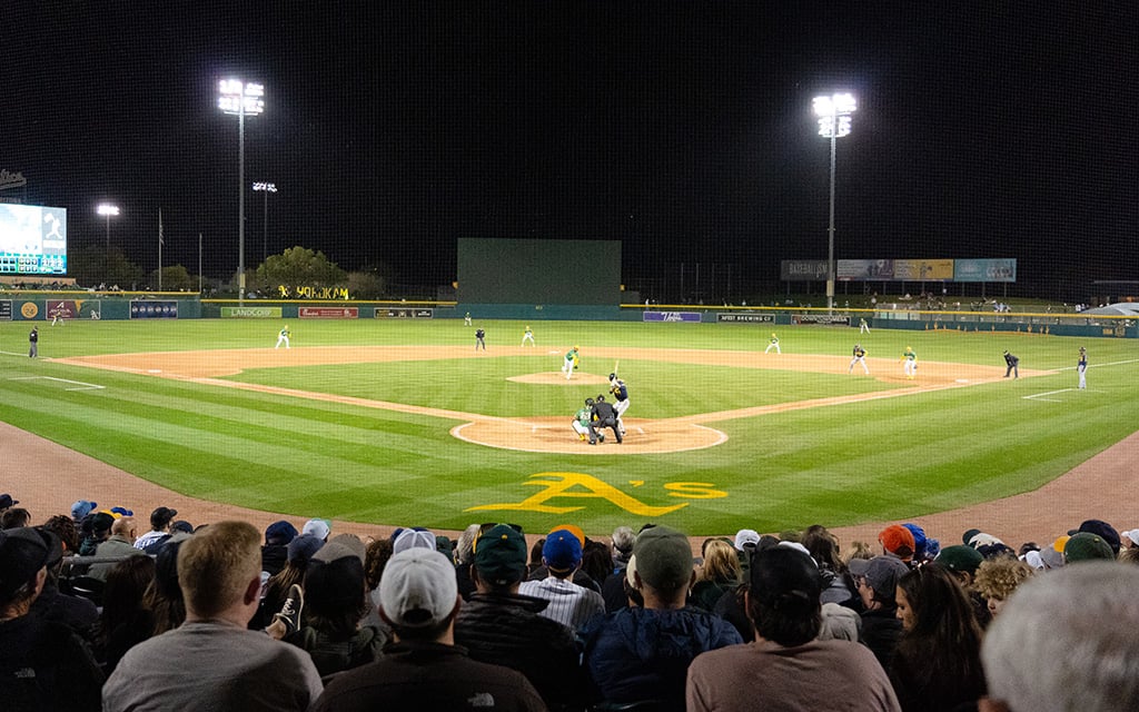 Fans watch a spring training baseball game between the Athletics and Milwaukee Brewers at Hohokam Stadium on March 6 in Mesa before the team moved to its temporary home in West Sacramento. (Photo by Anthony Chiu/Cronkite News)
