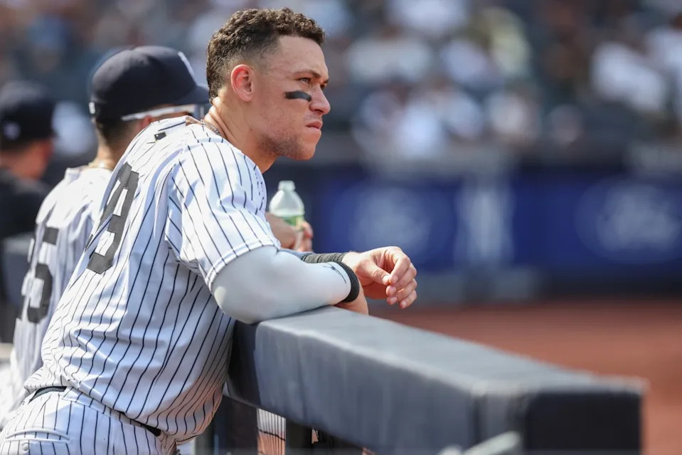 New York Yankees designated hitter Aaron Judge (99) watches from the dugout in the ninth inning against the Houston Astros at Yankee Stadium. Wendell Cruz-Imagn Images