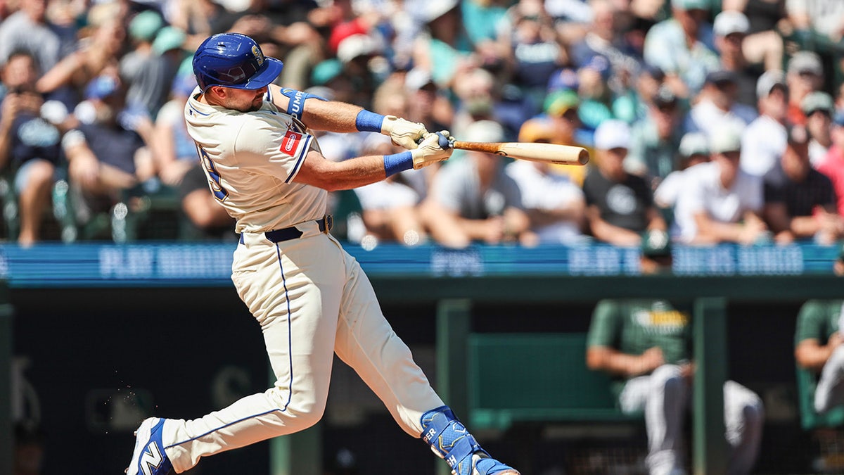 Cal Raleigh #29 of the Seattle Mariners hits his 48th home run of the season to tie the record for most home runs by a catcher during a single season during the first inning against the Athletics at T-Mobile Park on Aug. 24, 2025 in Seattle, Washington.