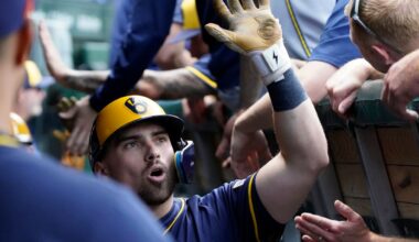 Milwaukee Brewers' Caleb Durbin is greeted in the dugout after hitting a two-run home run against the Chicago Cubs during the second inning of a baseball game Thursday, June 19, 2025, in Chicago.