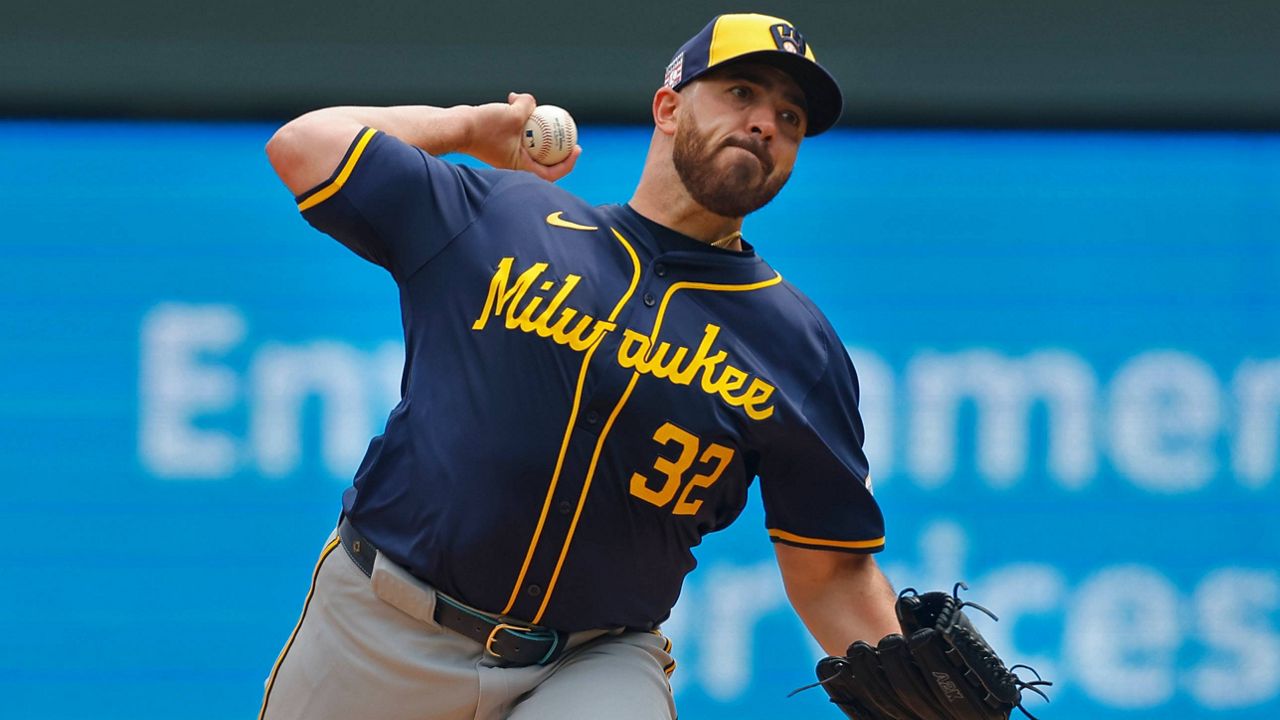 Brewers pitcher Aaron Civile pitches a baseball