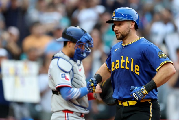 Cal Raleigh of the Mariners celebrates his solo home run against the Rangers on Thursday, July 31, 2025, in Seattle. (Steph Chambers/Getty Images)
