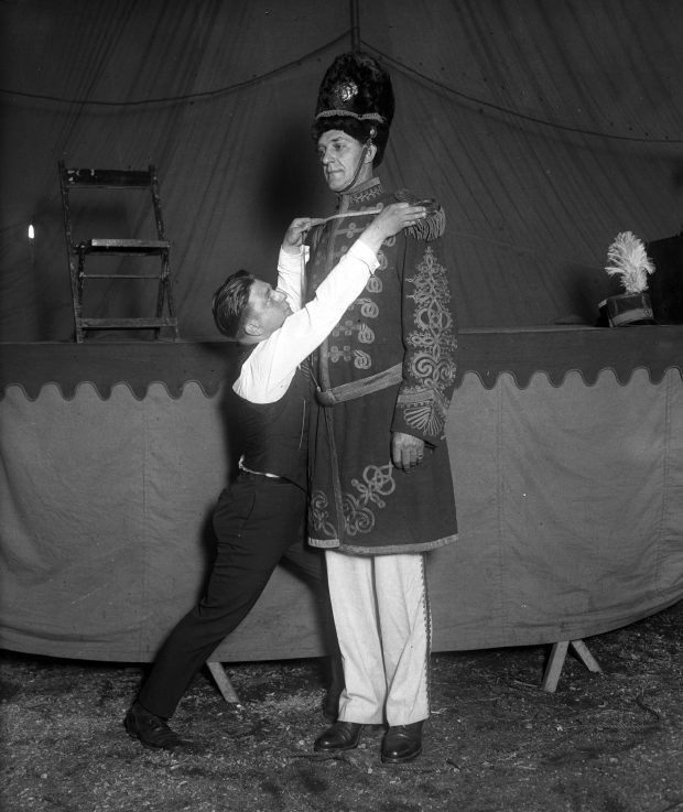 The "giant' Col. Gulliver and his tailor, Martin Rosen, of the Ringling Bros. Circus in Chicago. Gulliver also went by Capt. Gulliver and was anywhere between 7 feet tall and 8 feet 4 inches tall, according to reports. His real name was Alfred Ingall. (Chicago Herald and Examiner) 