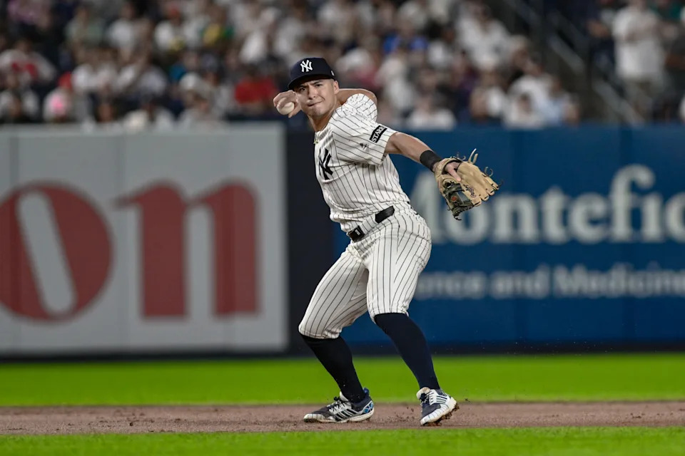 Aug 24, 2025; Bronx, New York, USA; New York Yankees shortstop Anthony Volpe (11) fields a ground ball hit by third baseman Alex Bregman (2) and throws to first for an out during the eighth inning at Yankee Stadium. Mandatory Credit: John Jones-Imagn Images