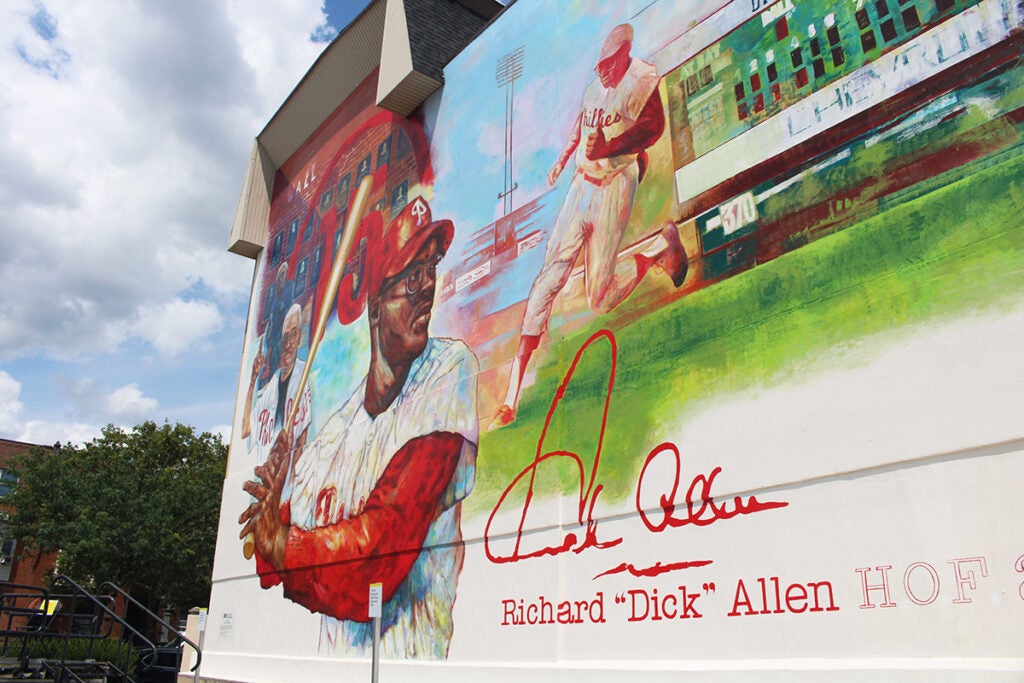 A mural dedicated to Philadelphia Phillies legend Dick Allen on the side of a building