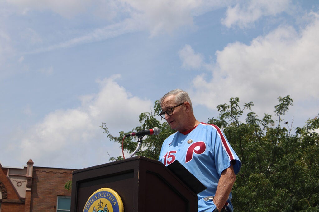 Former Philadelphia Mayor Jim Kenney speaks into a microphone at a podium