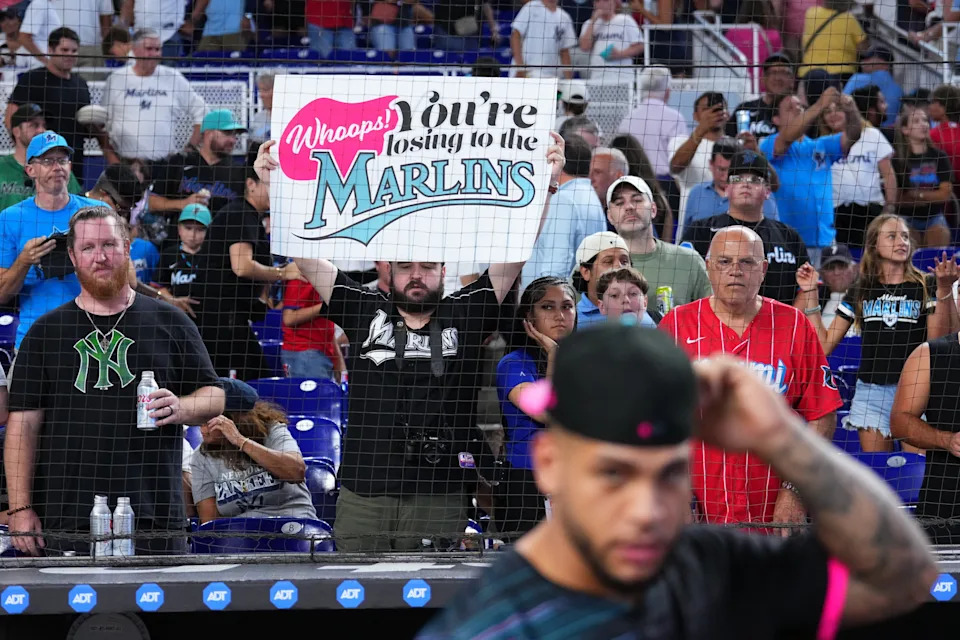 "Whoops! You're losing to the Marlins." Great sign. (Rich Storry/Getty Images)