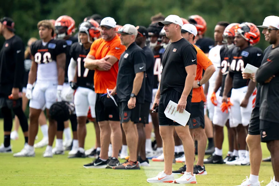 Cincinnati Bengals head coach Zac Taylor stand on the field at Cincinnati Bengals practice in Cincinnati on Tuesday, Aug. 5, 2025.