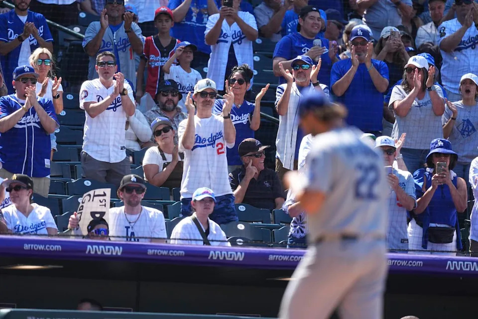 Fans applaud as Dodgers pitcher Clayton Kershaw heads to the dugout after being pulled from the mound in the sixth inning.