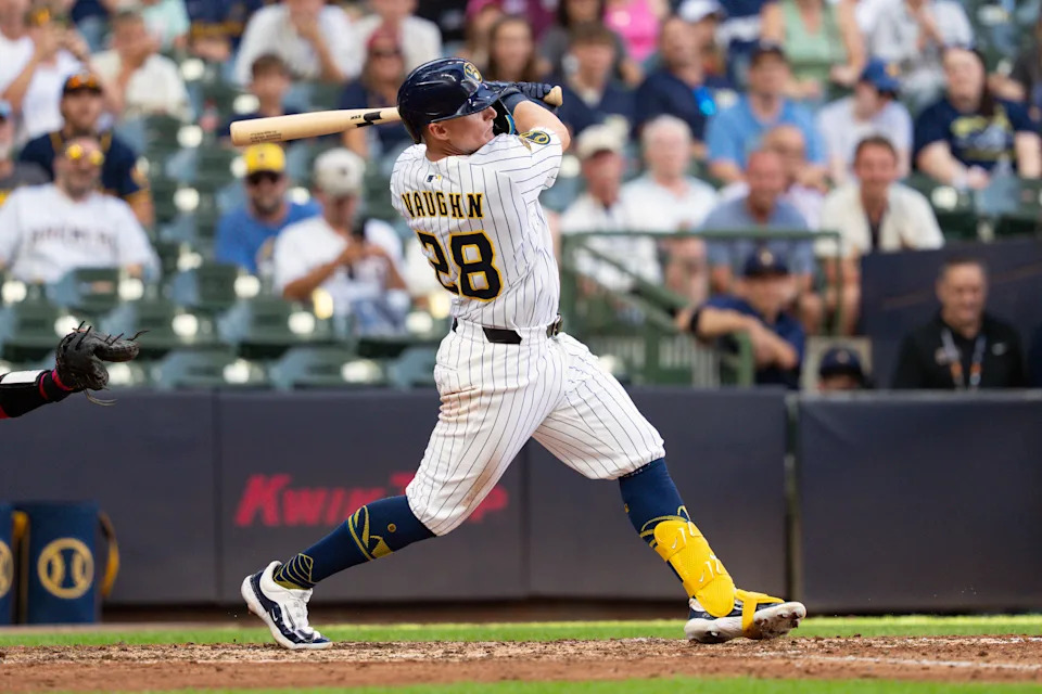 Jul 12, 2025; Milwaukee, Wisconsin, USA;  Milwaukee Brewers first baseman Andrew Vaughn (28) hits an RBI double during the ninth inning against the Washington Nationals at American Family Field. Mandatory Credit: Jeff Hanisch-Imagn Images