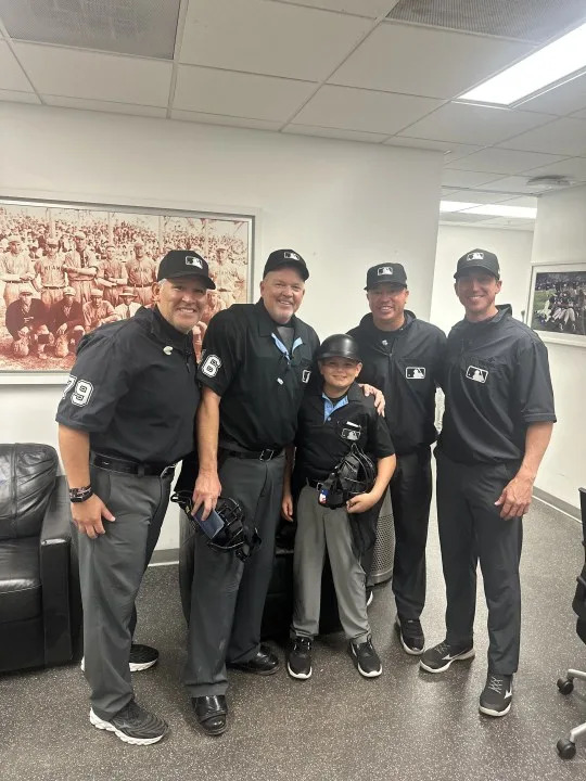 Bradley Vinson meets with MLB umpires during spring training. (Photos courtesy: John Vinson)