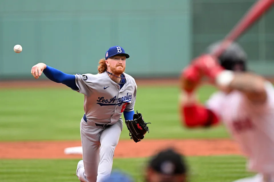 Dustin May, shown pitching against the Red Sox on July 27, was traded from Los Angeles to Boston on July 31.