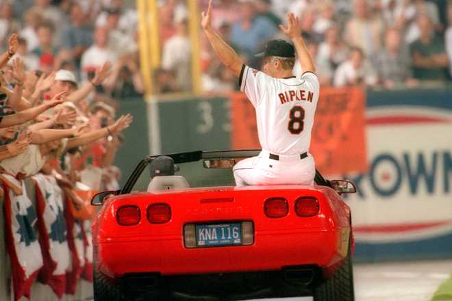 BALTIMORE, MD - SEPTEMBER 06: Cal Ripken Jr. #8 of the Baltimore Orioles celebrates breaking Lou Gehrig's record for consecutive game played with his 2131 career game, during a game against the California Angels at Oriole Park at Camden Yards on September 6, 1995 in Baltimore, Maryland. (Photo by Mitchell Layton/Getty Images)