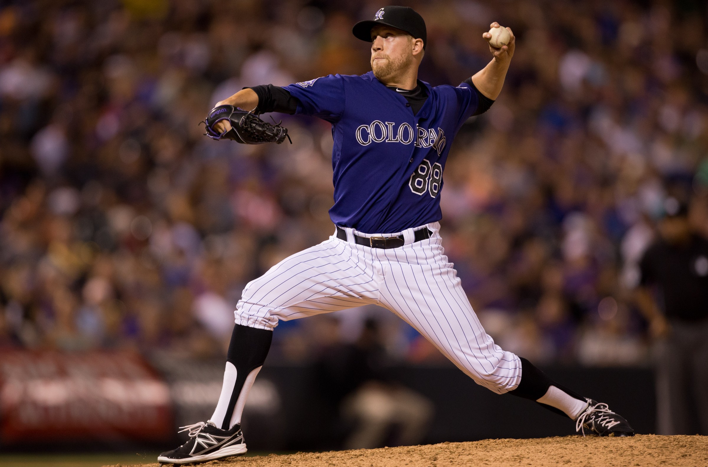 DENVER, CO - JULY 20: Relief pitcher Josh Outman #88 of the Colorado Rockies delivers to home plate during the eighth inning against the Chicago Cubs at Coors Field on July 20, 2013 in Denver, Colorado. The Rockies defeated the Cubs 9-3. (Photo by Justin Edmonds/Getty Images)