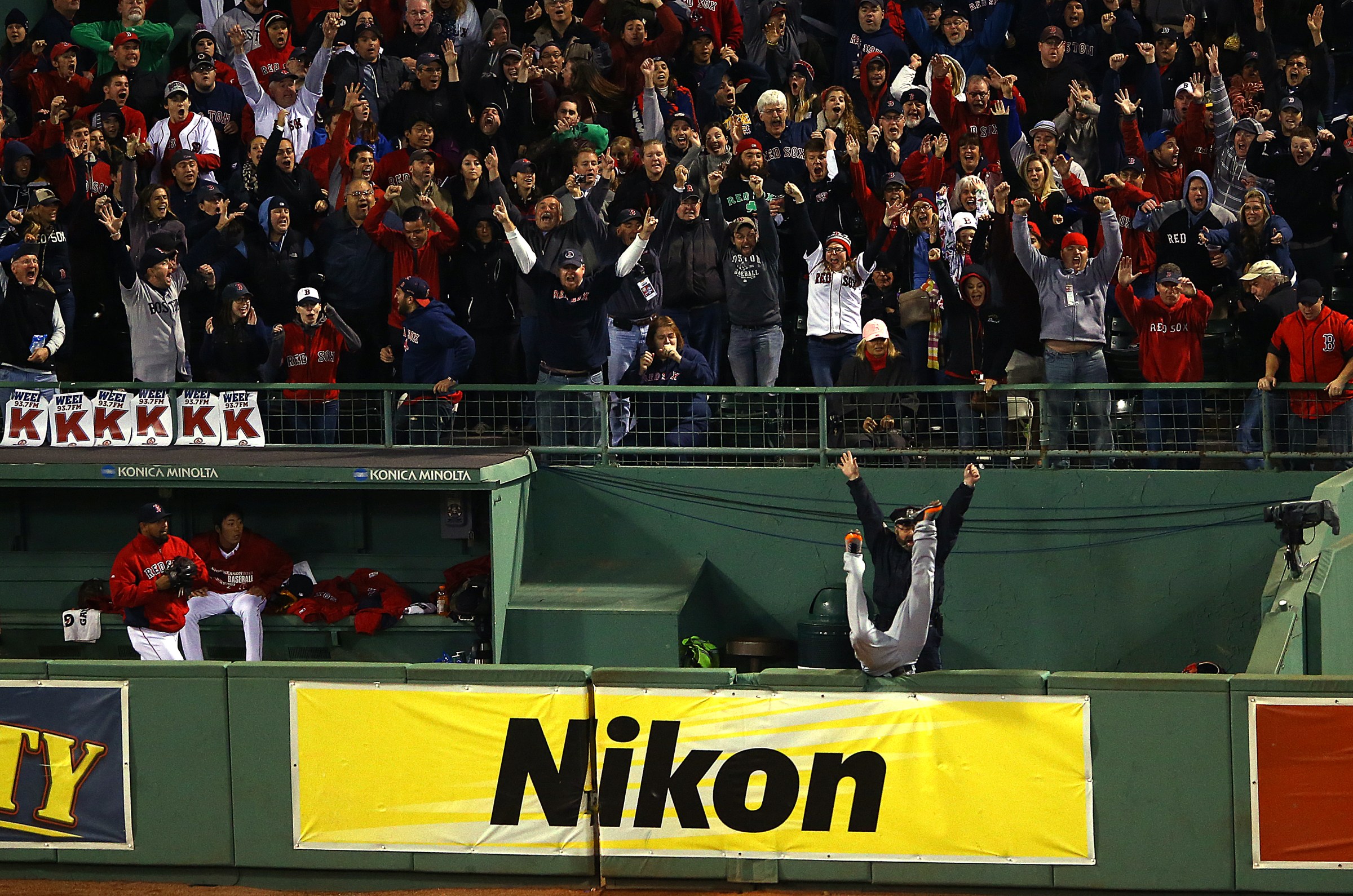 BOSTON, MA - OCTOBER 13: Torii Hunter #48 of the Detroit Tigers tries to catch a grand slam hit by David Ortiz #34 of the Boston Red Sox in the eighth inning of Game Two of the American League Championship Series at Fenway Park on October 13, 2013 in Boston, Massachusetts. (Photo by Al Bello/Getty Images)