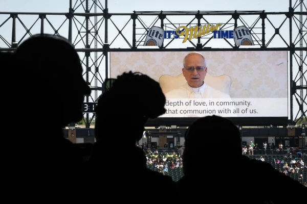 Pope Leo XIV addresses Catholic faithful on the scoreboard at Rate Field, home to the Chicago White Sox, during a celebration and Mass to honor his election as pope on June 14, 2025, in Chicago. Credit: Scott Olson/Getty Images