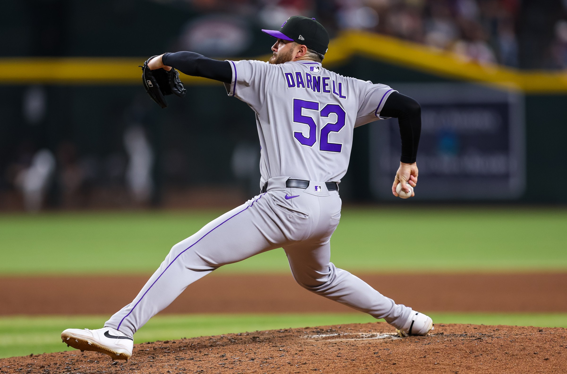 PHOENIX, ARIZONA - AUGUST 09: Dugan Darnell #52 of the Colorado Rockies pitches during the sixth inning against the Arizona Diamondbacks at Chase Field on August 09, 2025 in Phoenix, Arizona. (Photo by Mike Christy/Getty Images)