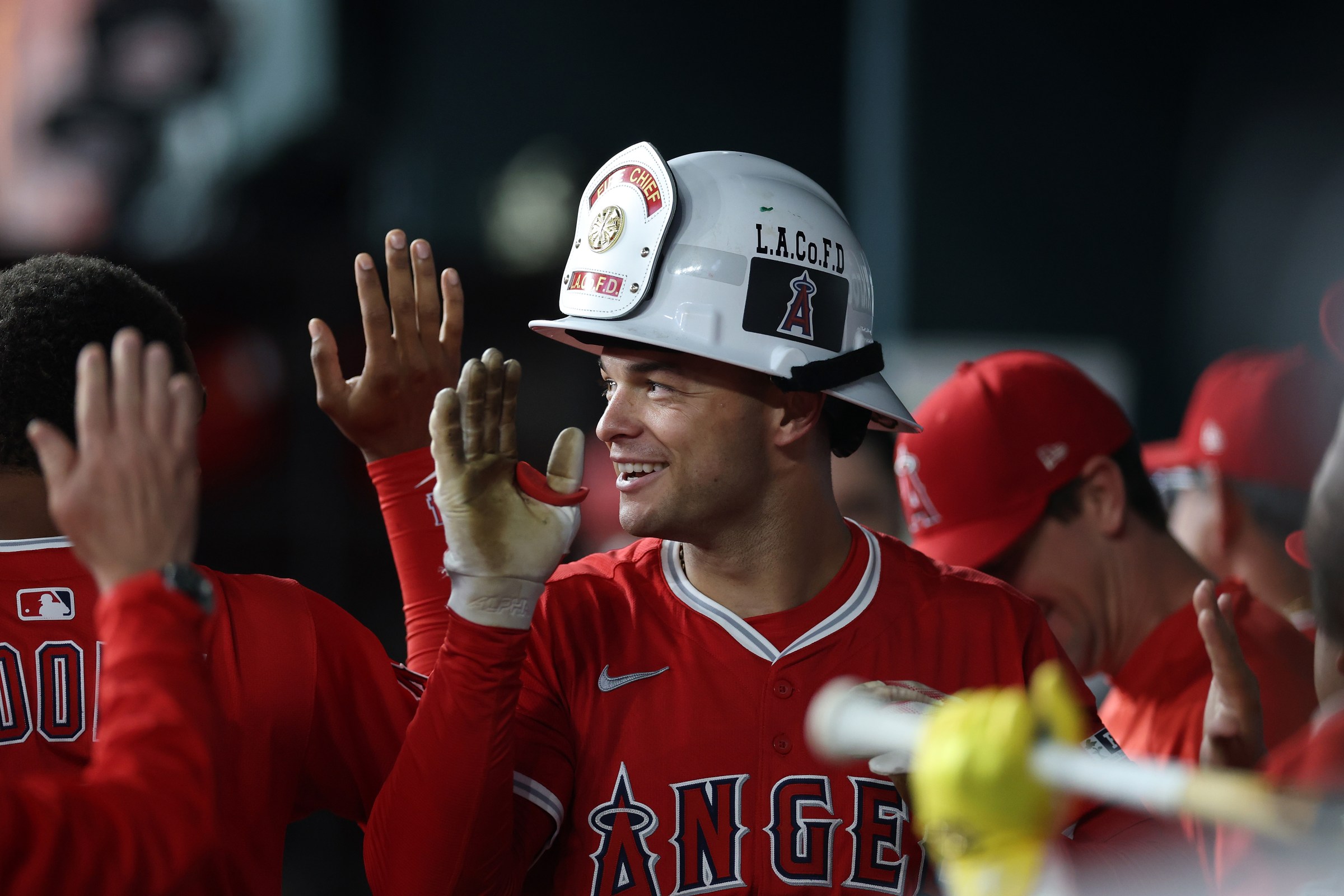 ARLINGTON, TEXAS - AUGUST 25: Logan O’Hoppe #14 of the Los Angeles Angels is congratulated by teammates following a home run against the Texas Rangers during the ninth inning at Globe Life Field on August 25, 2025 in Arlington, Texas. (Photo by Stacy Revere/Getty Images)