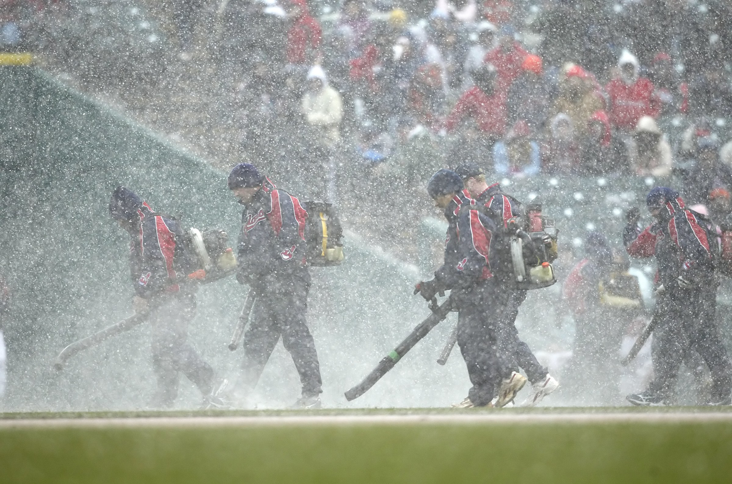 06 April 2007: Cleveland Indians grounds crew blows snow off the field during a game against the Seattle Mariners on opening day at Jacobs Field in Cleveland, OH. (Photo by Ron Schwane /Icon SMI/Icon Sport Media via Getty Images)