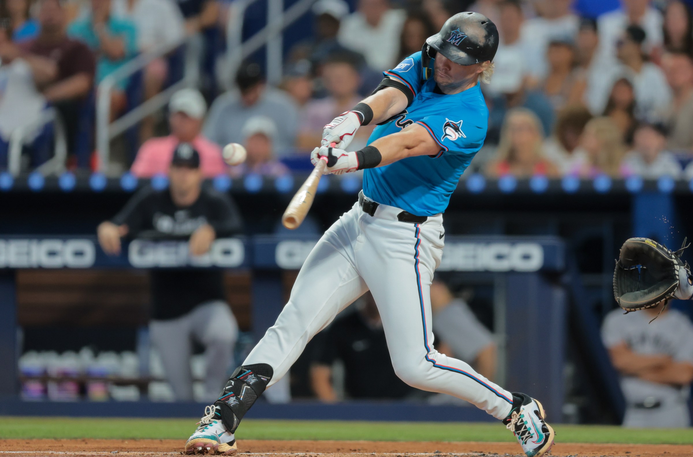 Aug 3, 2025; Miami, Florida, USA; Miami Marlins left fielder Kyle Stowers (28) hits a single against the New York Yankees during the first inning at loanDepot Park. Mandatory Credit: Sam Navarro-Imagn Images