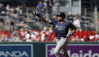Tampa Bay Rays' Josh Lowe gestures as he runs the bases after hitting a three-run home run against Washington Nationals pitcher Jake Irvin, which scored Brandon Lowe and Junior Caminero, during the first inning of a baseball game, Saturday, Aug. 30, 2025, in Washington. (AP Photo/Terrance Williams)