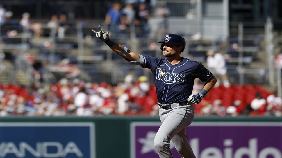 Tampa Bay Rays' Josh Lowe gestures as he runs the bases after hitting a three-run home run against Washington Nationals pitcher Jake Irvin, which scored Brandon Lowe and Junior Caminero, during the first inning of a baseball game, Saturday, Aug. 30, 2025, in Washington. (AP Photo/Terrance Williams)