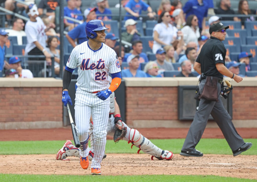 Juan Soto #22 of the New York Mets smiles after hitting a home run.