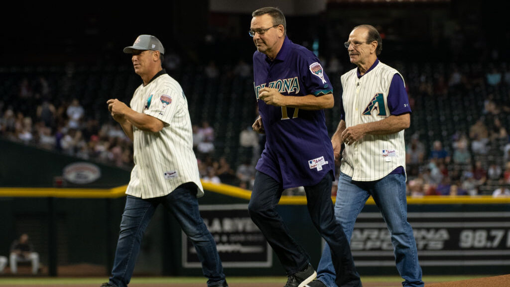 Luis Gonzalez, Mark Grace and Bob Brenly throw out the Ceremonial First Pitch prior to the MLB game...