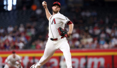 Diamondbacks starting pitcher Merrill Kelly winding up on the mound...