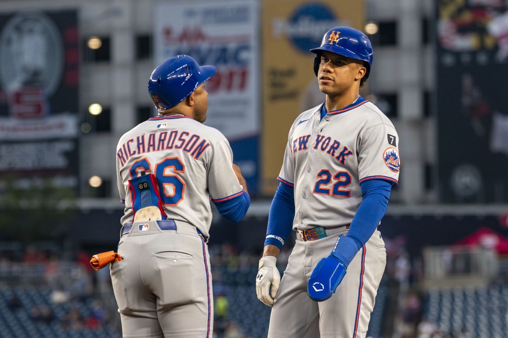 Two New York Mets baseball players in uniform.