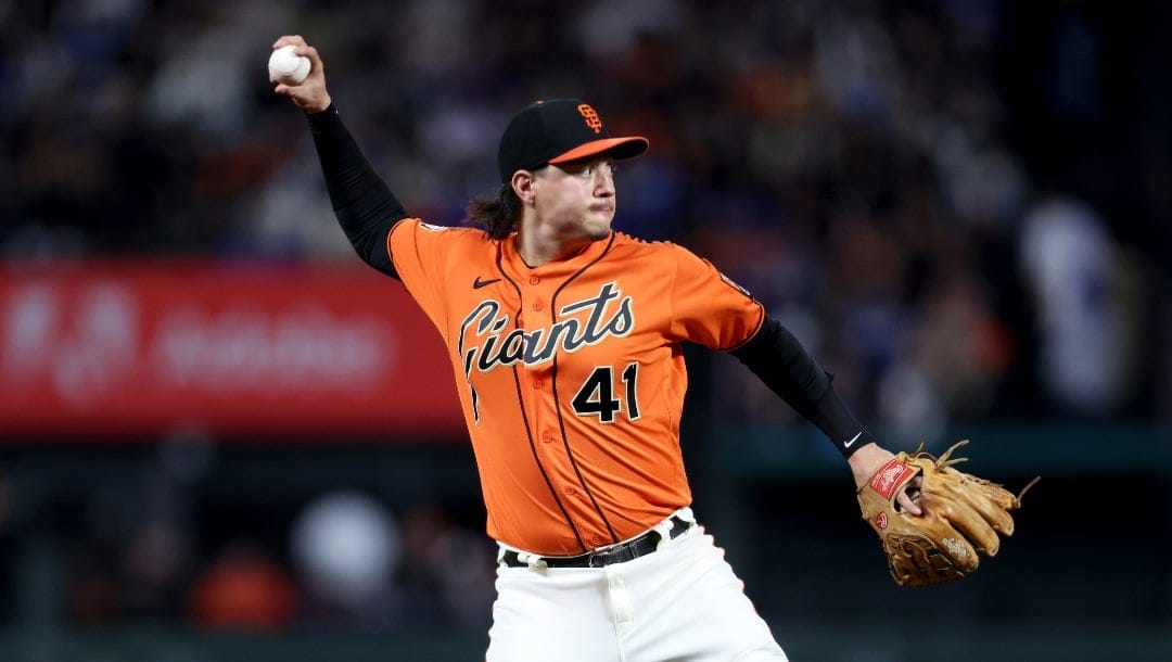 San Francisco Giants' Wilmer Flores (41) throws to first against the Los Angeles Dodgers during a baseball game in San Francisco, Friday, Sept. 29, 2023. (AP Photo/Jed Jacobsohn)