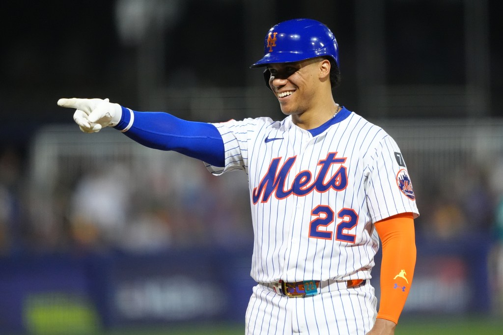 Juan Soto #22 of the New York Mets points during a baseball game.Mets outfielder Juan Soto (22) reacts after being walked against the Seattle Mariners in the third inning at Journey Bank Ballpark