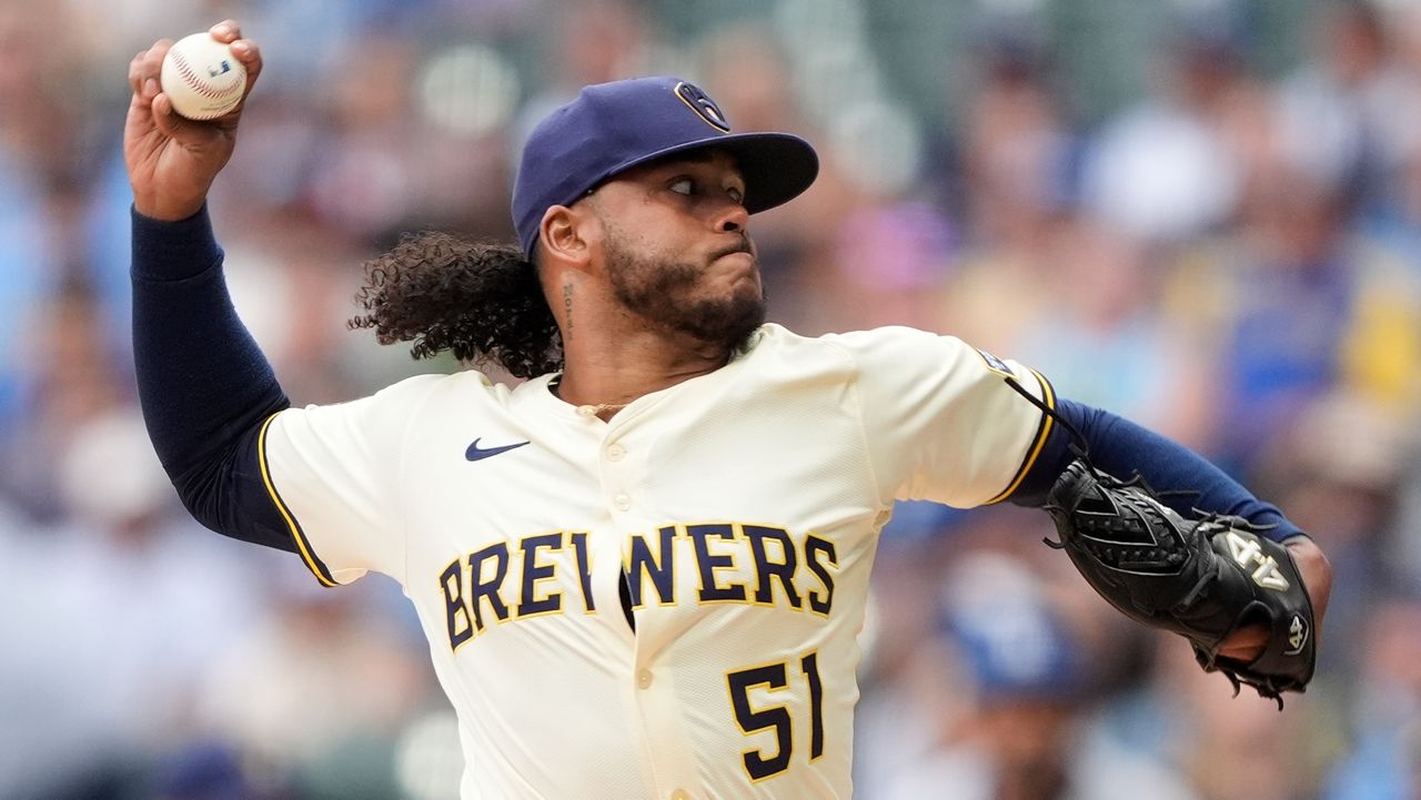 Milwaukee Brewers' Freddy Peralta pitches during the first inning of a baseball game against the Los Angeles Dodgers, Monday, July 7, 2025, in Milwaukee.