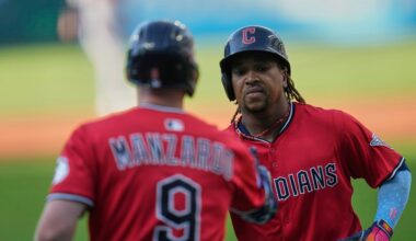 Cleveland Guardians' Jose Ramirez, right, is congratulated by Kyle Manzardo (9) after his home run in the first inning of a baseball game against the Baltimore Orioles in Cleveland, Tuesday, July 22, 2025. (AP Photo/Sue Ogrocki)