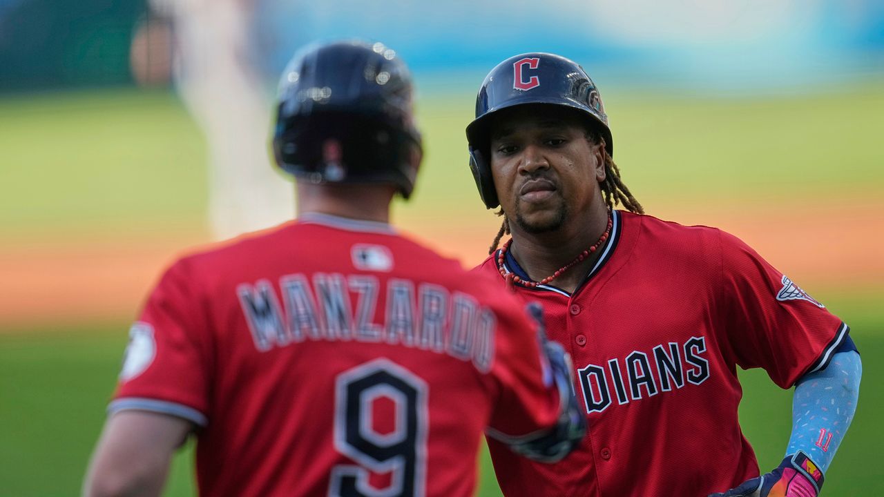 Cleveland Guardians' Jose Ramirez, right, is congratulated by Kyle Manzardo (9) after his home run in the first inning of a baseball game against the Baltimore Orioles in Cleveland, Tuesday, July 22, 2025. (AP Photo/Sue Ogrocki)