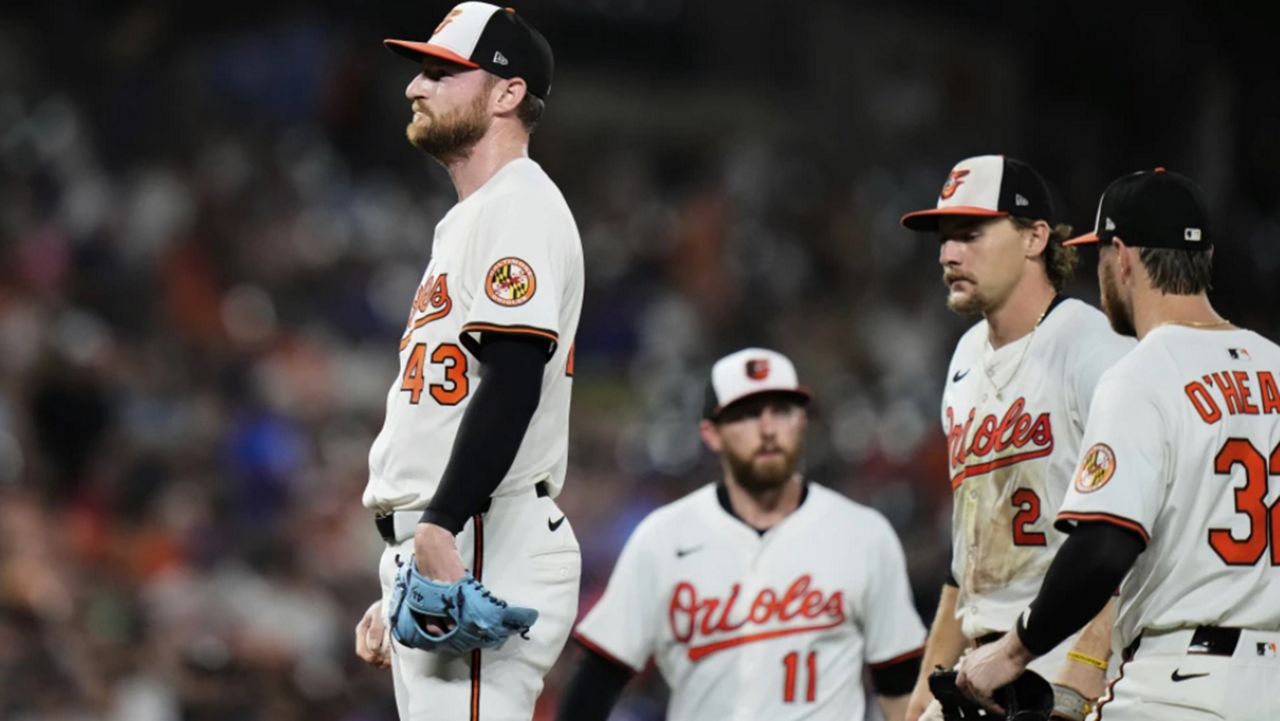 Baltimore Orioles relief pitcher Bryan Baker (43) leaves the mound in a pitching substitution after giving up four runs during the eighth inning of a baseball game against the New York Mets, Tuesday, July 8, 2025, in Baltimore. (AP Photo/Stephanie Scarbrough)