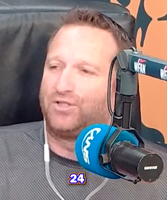 Man speaking into a microphone.