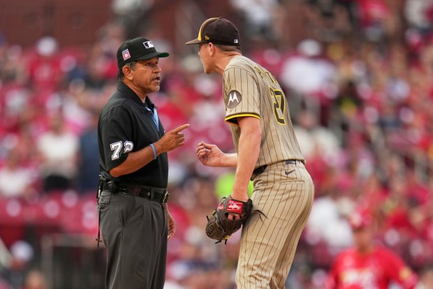 Padres starting pitcher Nick Pivetta talks with umpire Alfonso Marquez during the second inning of Friday's game against the Cardinals. (AP Photo/Jeff Roberson)