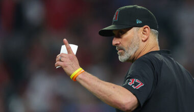 Torey Lovullo #17 of the Arizona Diamondbacks calls for Justin Martinez #63 as a relief pitcher whi...