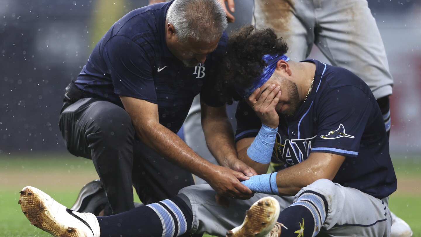 Rays' Jonathan Aranda collides with Giancarlo Stanton and exits game with wrist injury