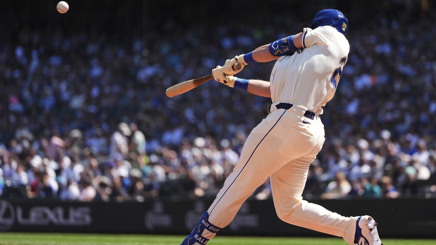 Cal Raleigh hits 48th, 49th homers to set MLB season mark for catchers, passes Salvador Perez