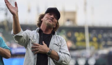 Pearl Jam's Eddie Vedder tests out new MLB guitar trophy
