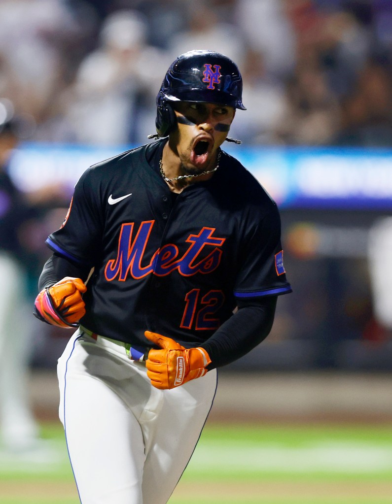 New York Mets player celebrating.