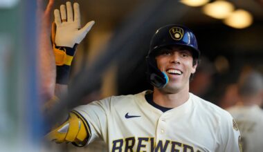 Milwaukee Brewers' Christian Yelich smiles in the dugout after hitting a solo home run during the third inning of a baseball game against the Pittsburgh Pirates, Monday, Aug. 11, 2025, in Milwaukee.