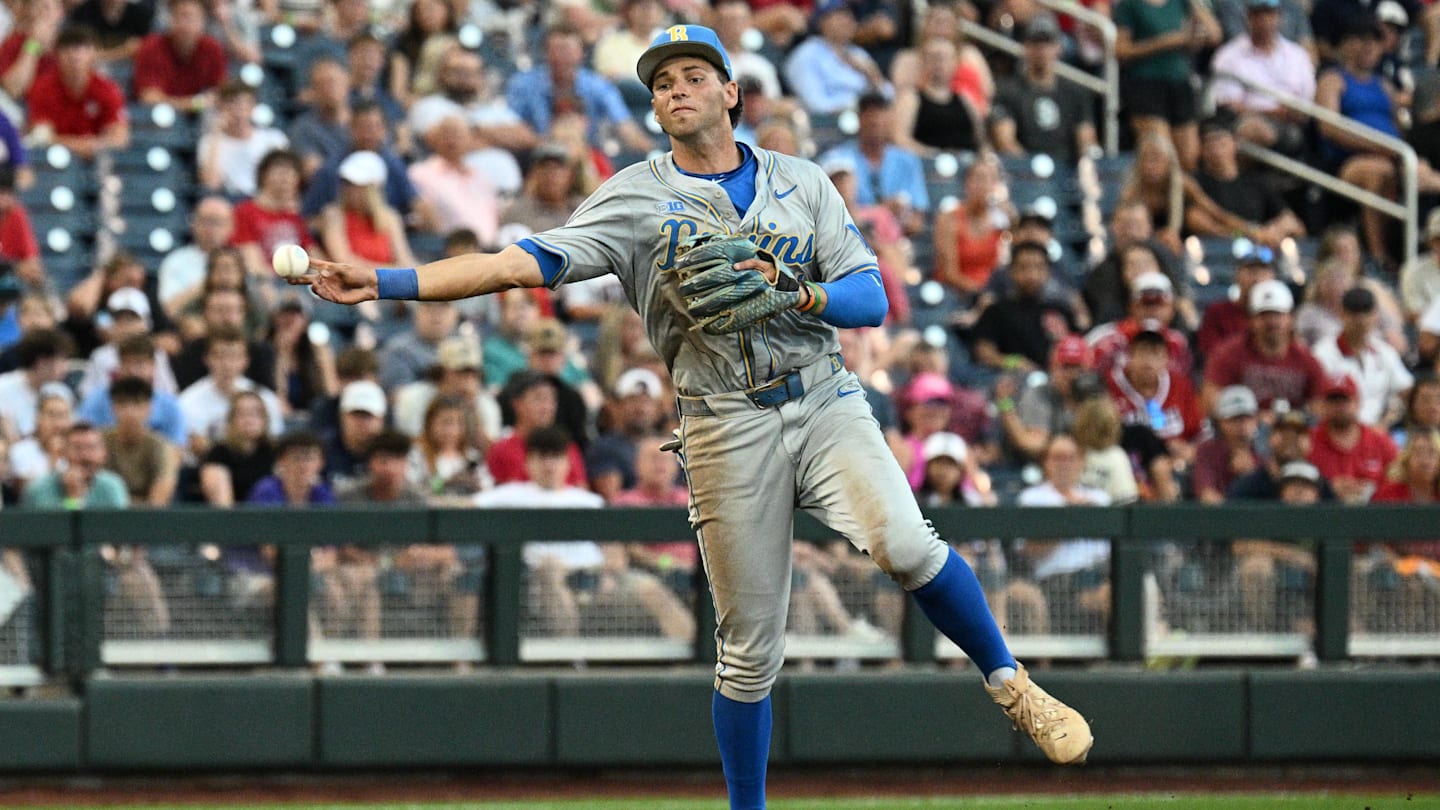 Jun 17, 2025; Omaha, Neb, USA;  UCLA Bruins shortstop Roch Cholowsky (1) throws to first base against the Arkansas Razorbacks during the third inning at Charles Schwab Field. Mandatory Credit: Steven Branscombe-Imagn Images
