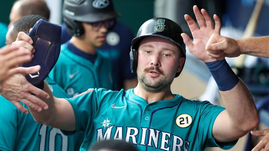 Seattle Mariners catcher Cal Raleigh (29) is congratulated by teammates after hitting a home run
